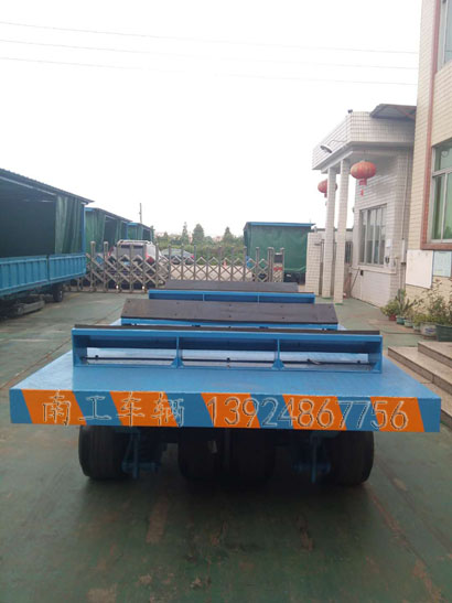 1676945632141191.jpg 30噸重型鐵皮卷圓桶專用平板車4I.jpg